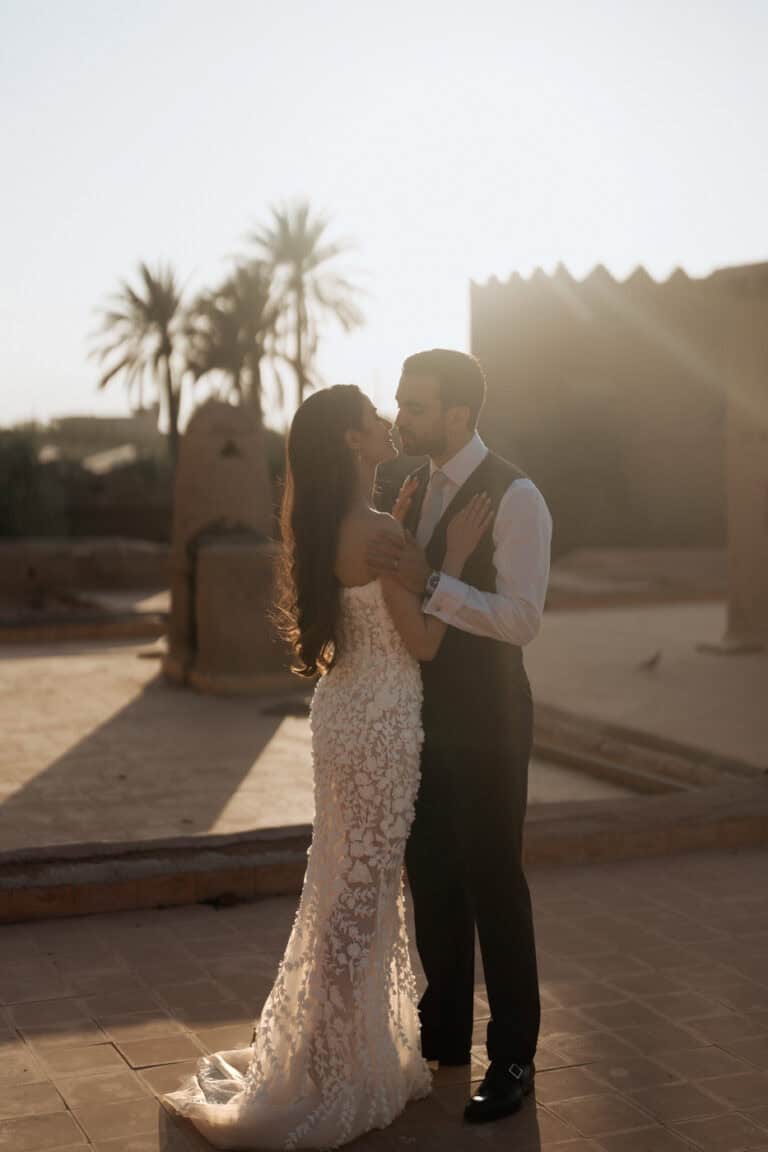 a groom and bride kissing, on roof top beldi country club marrakech