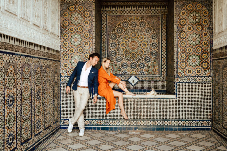 Valentina and Edward beside the zellige mosaics at Dar El Bacha in Marrakech