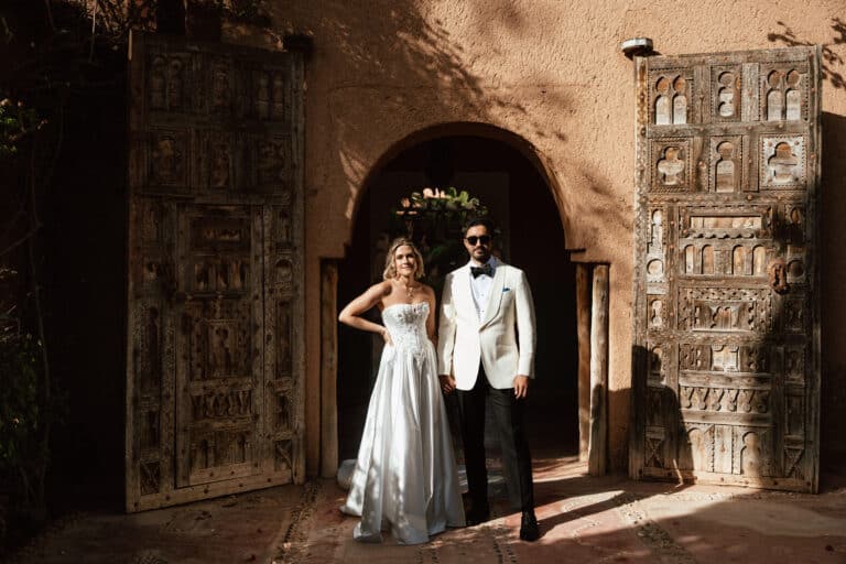 Harriet and Rayan in front of the carved wooden doors at Beldi Country Club, Marrakech